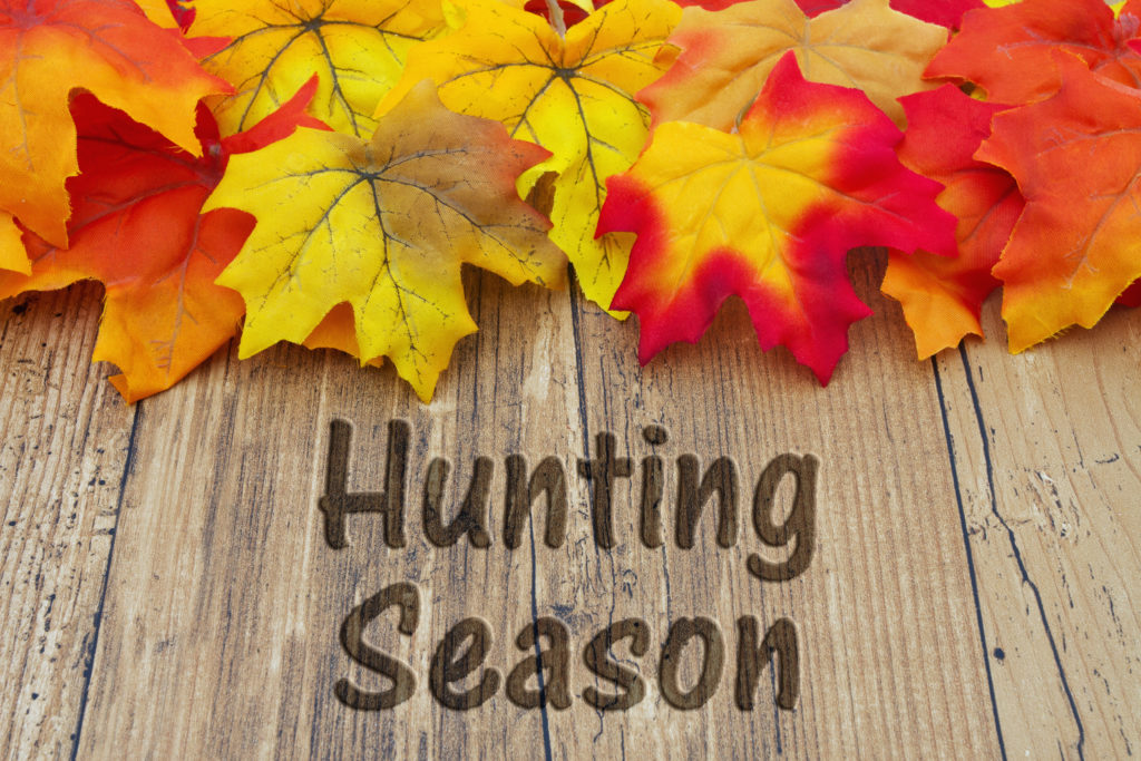 Hunting Season, Autumn Leaves on a Weathered Wood Background with text Hunting Season